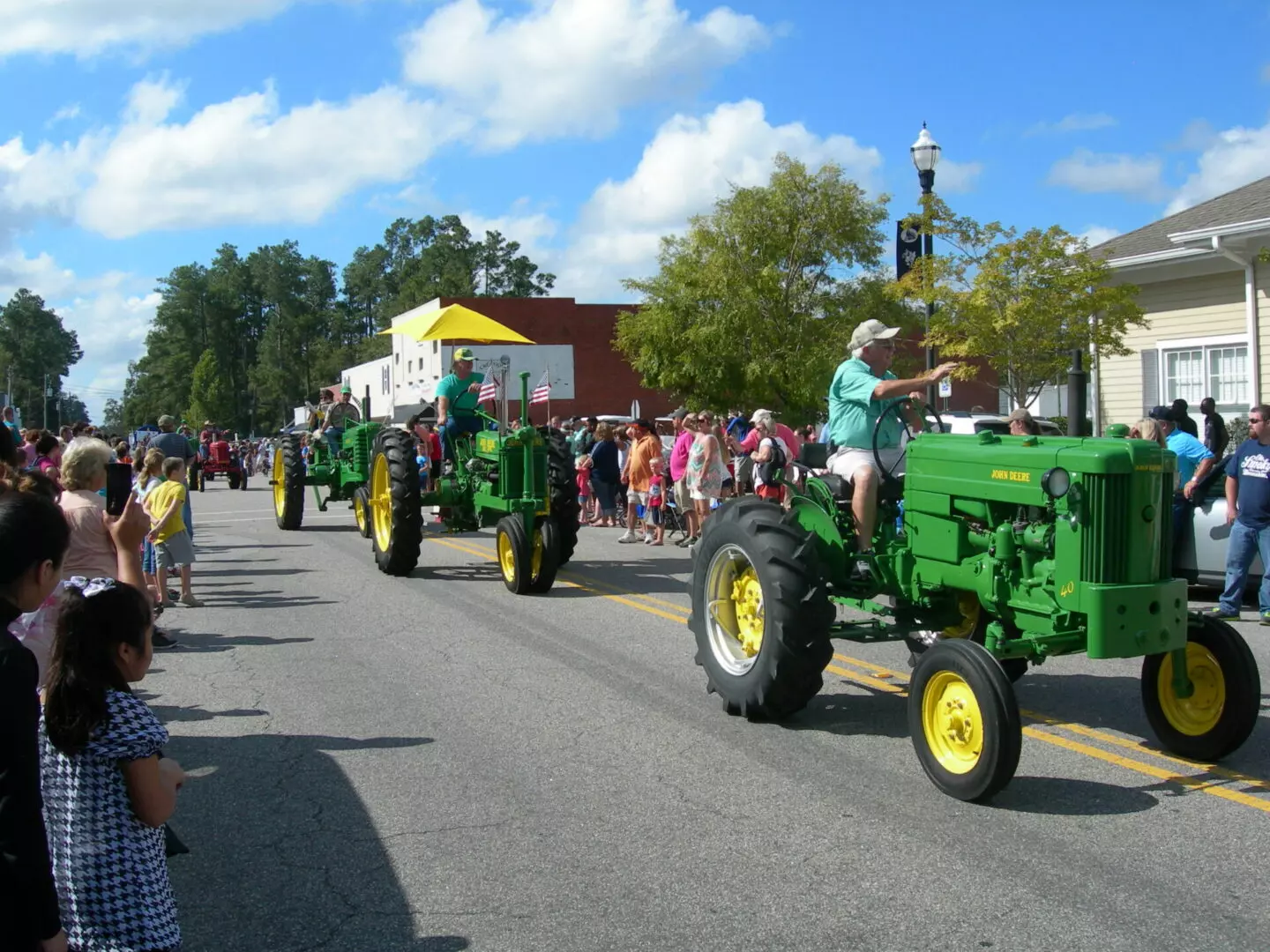 Parade of green tractors